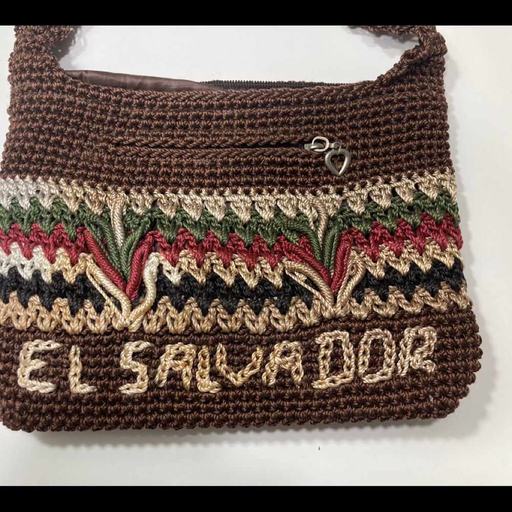 Small purse :10”wide,7”high,17” long strap. Great for those flea market days!